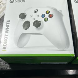 1 White & 1 Black X-Box Controllers - 3 Months Old