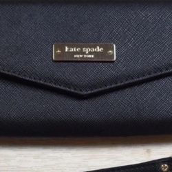 Kate Spade wallet/wristlet  6.5" x 3".  Removable wristlet strap.  It is about 6.75" by 4.25".  Gold tone hardware.  