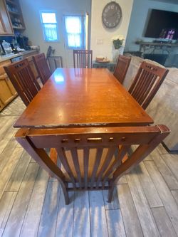 Mission style wood dining table and 6 chairs in good condition