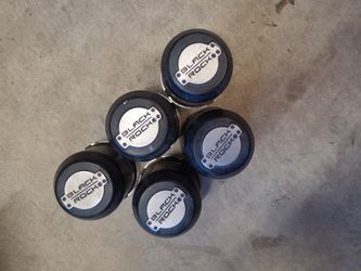 5 Black Rock Center Caps Off Jeep JK