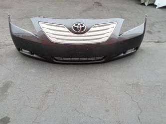 2007-2009 Toyota Camry complete front bumper with All the accessories oem.