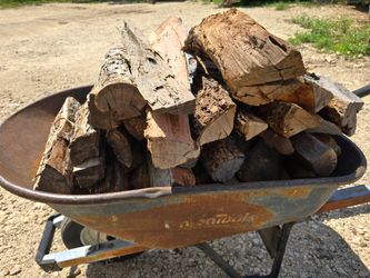 Large wheel barrow of Premium Seasoned split MESQUITE bbq Firewood  - $55