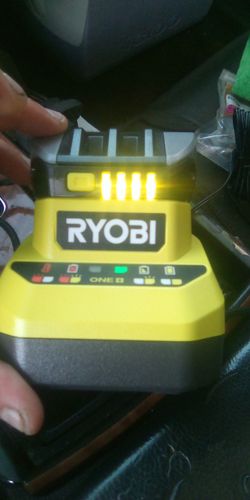 1.RYOBI BATTERY CHARGER.2.18V 2AH BATTERY AND 1.5 AH BATTERY