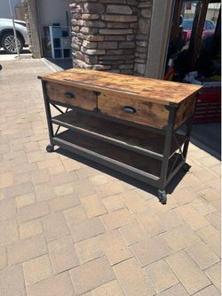 TV stand.  Has 2 storage drawers.  Very sturdy.