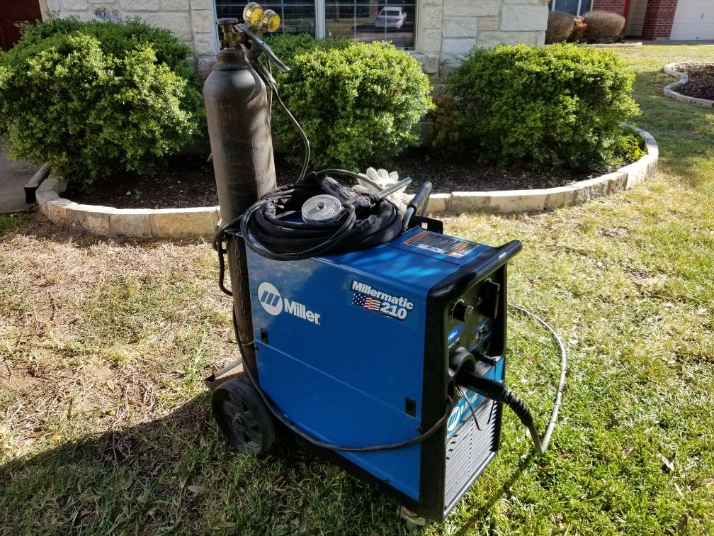 Millermatic 210 welder w/two bottles and aluminum spool gun for Sale in