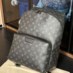 Louis Vuitton Monogram Eclipse Discovery Backpack, featuring the iconic brand's monogram canvas in a sleek black and grey colorway