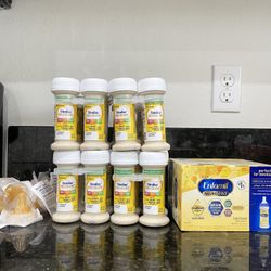 38 - 2 fl oz Bottles Of Baby Formula 