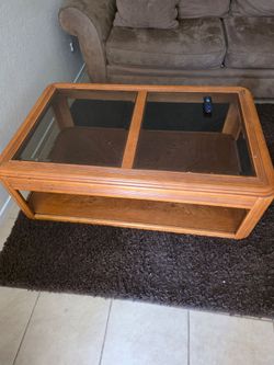 Glass topped coffee table