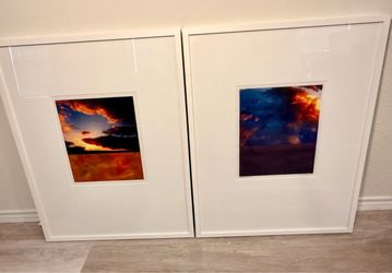 Two Framed Sunset Photographs