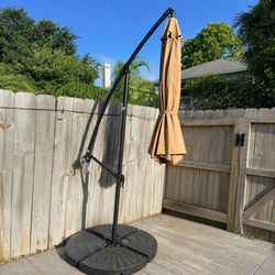 Large Tan Cantilever Patio Umbrella with Weighted Base