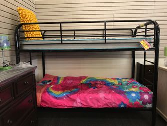 Brand new Twin over Twin Bunk Bed ( Mattresses are not included)