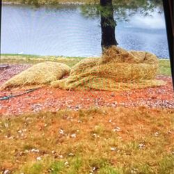 HAY ROLLED IN A NET FOR EASY CLEAN UP AND TRANSPORT