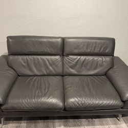a Leather Couch  and A love Seat Set