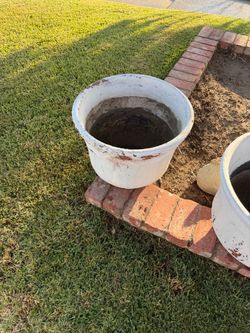 Clay pots painted white