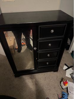 Woman’s/girl black dresser with sliding mirror