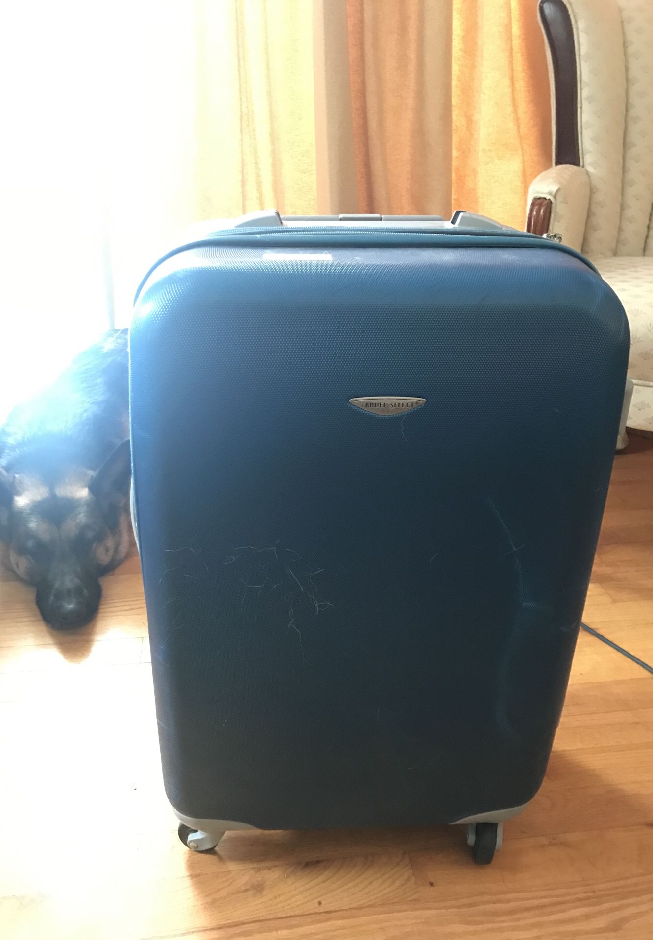 Blue hard shell suitcase