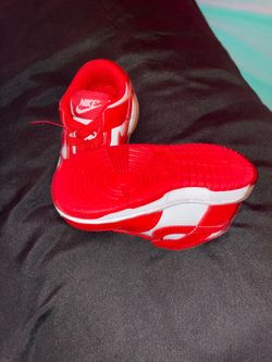 Red and white Nike dunk lows