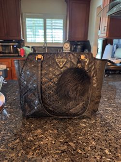 Guess purse with pompom and LA keychains