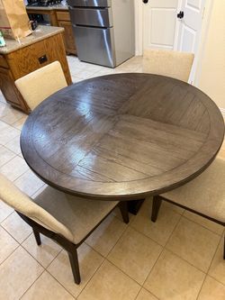 54 in round dining room table and chairs
