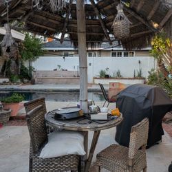 Tiki Style Umbrella With Chairs