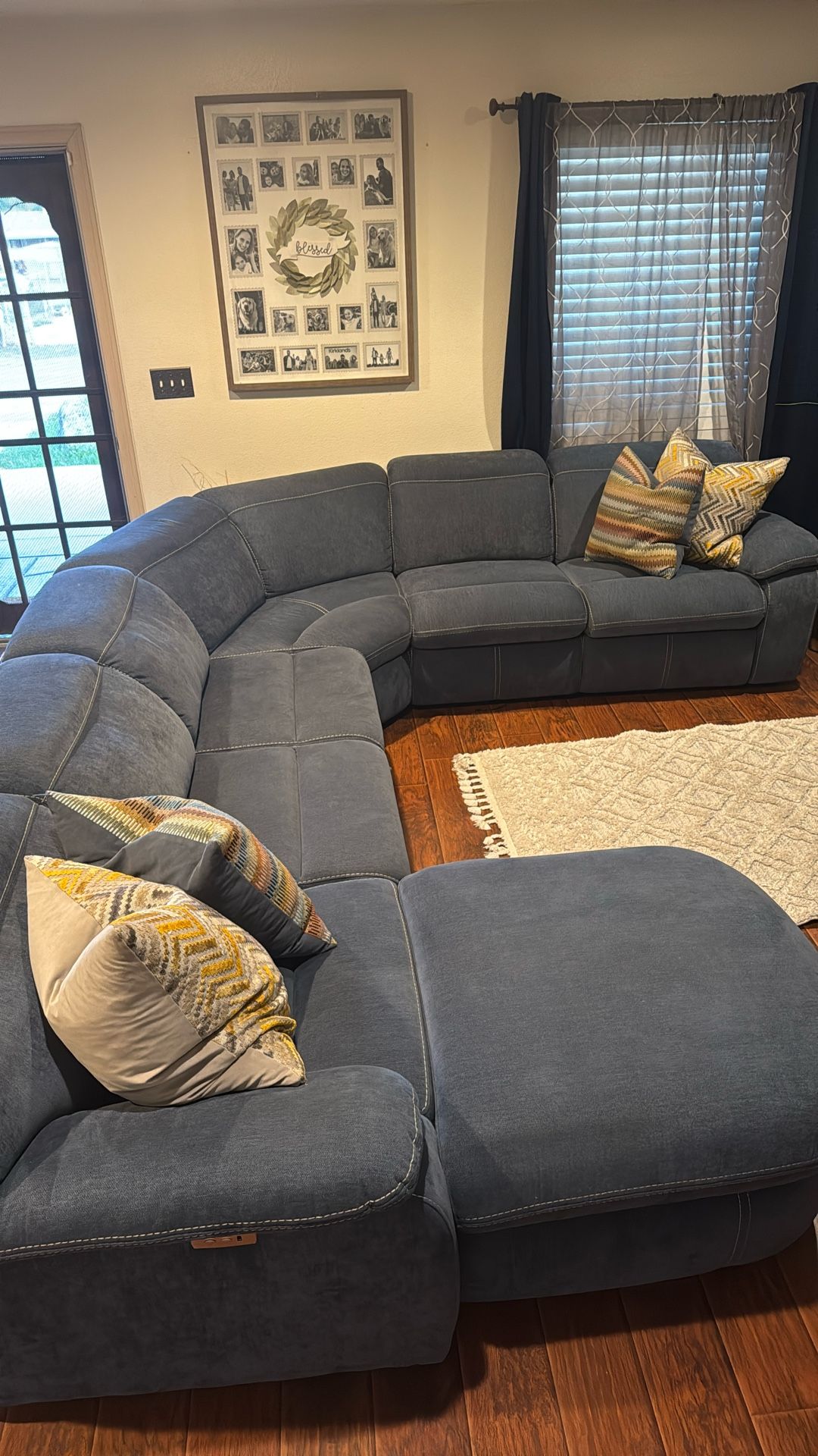 Reclining sectional sofa with a trundle