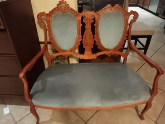 Mid Century Bohemian two-seater Victorian chairlegant vintage wooden loveseat with blue upholstery.