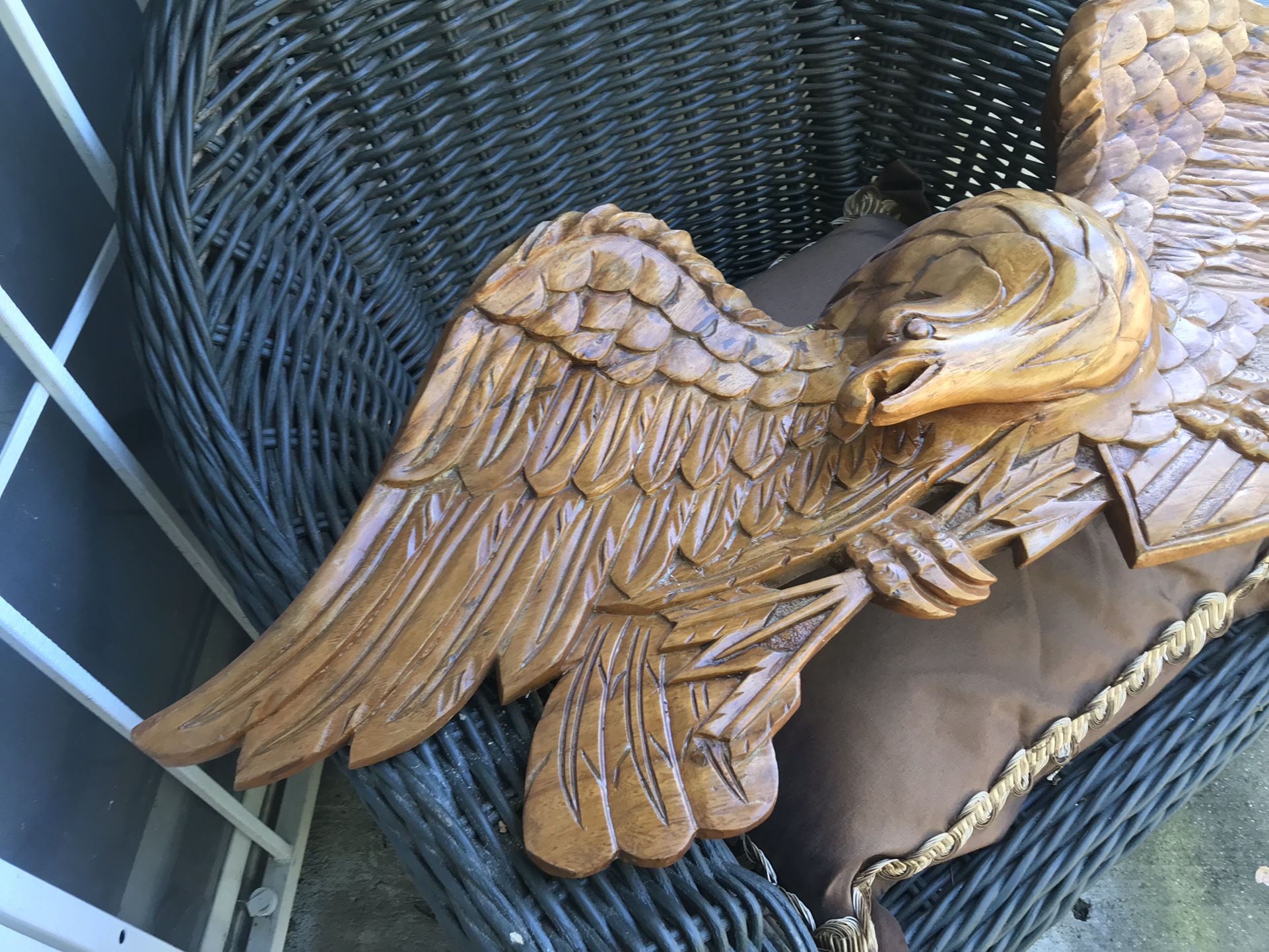 An eagle carved out of wood shed size for the 60s