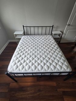 Full bed mattress and frame.