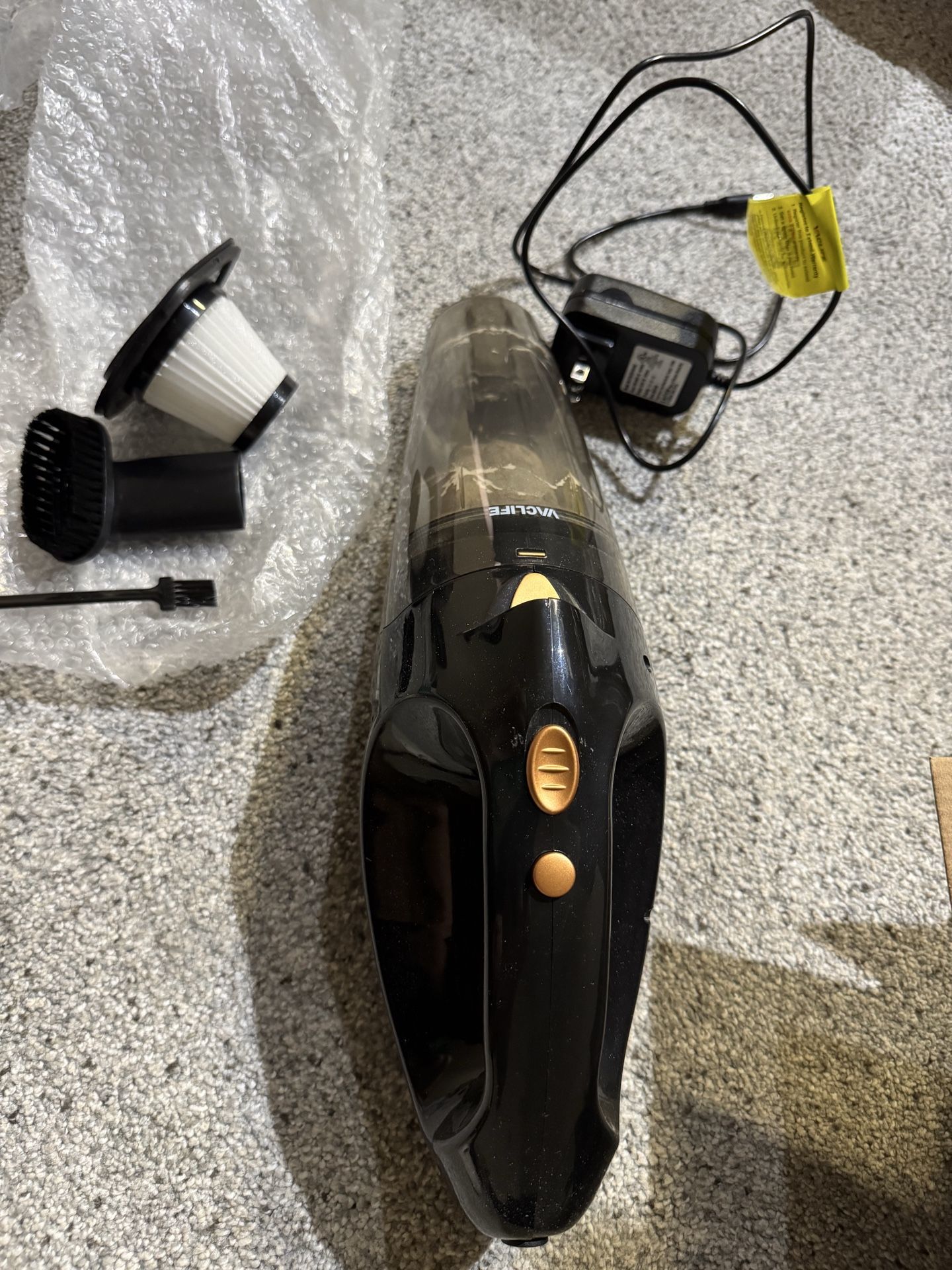 Hand-held portable vacuum
