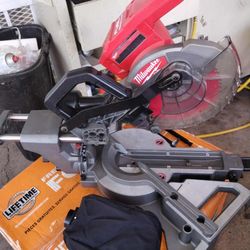 Used Milwaukee M18 FUEL 7-1/4" dual bevel Sliding Compound Miter Saw TOOL ONLY ( doesn't have fences & center plate look pictures)