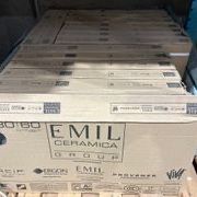 Tile Gray tile w/ brushed stone-look finish, size approx. 11 13/16 x 23 5/8. 17 boxes