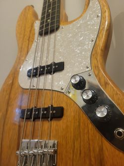 Custom black limba bass guitar