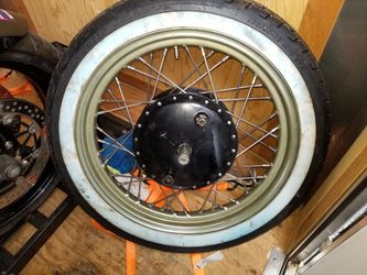1970 ironhead sportster front wheel. Rebuilt at shop in Portland. Out of 3 wheels, new spikes and hub bearings and tire.