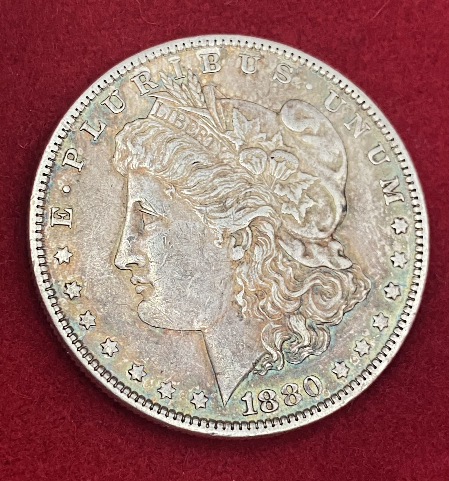 1880-O $1 Morgan Silver Dollar - Luster - Rainbow Rim Toning