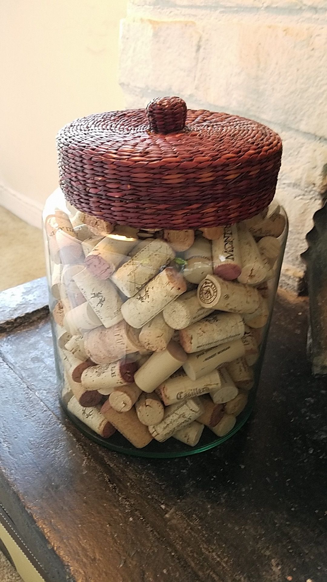 Decorative glass jar with woven lid