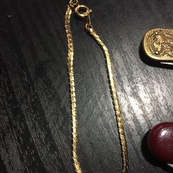 Gold Necklace ? Bracelet?