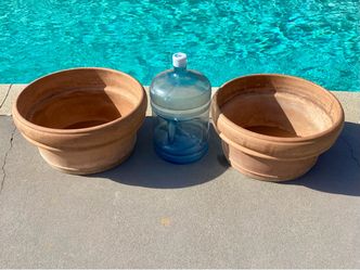 A pair of large made in Italy terracotta pots
