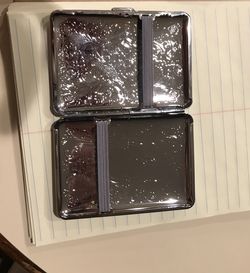 Silver cigarette case with tree insignia