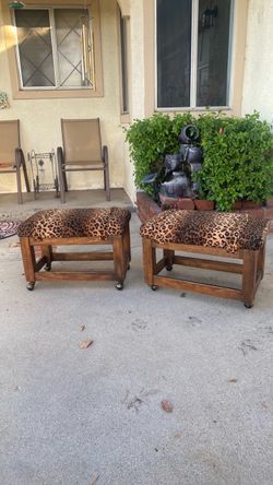 2 leopard ottomans with wheels