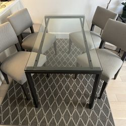 Crate & Barrel Glass Dining Table with 4 Chairs – Seats 4–6