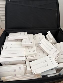 90+ new phone chargers and safe box with lock.