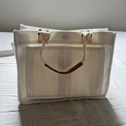 Cream canvas tote bag with straps and interior