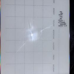 Dry erase calendar and furry picture wall