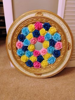 Home decor piece 22.5" round. Gold with multi color flowers.