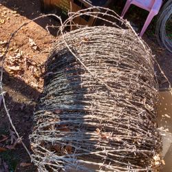 Rolls Of Barb Wire And Electrical Wire
