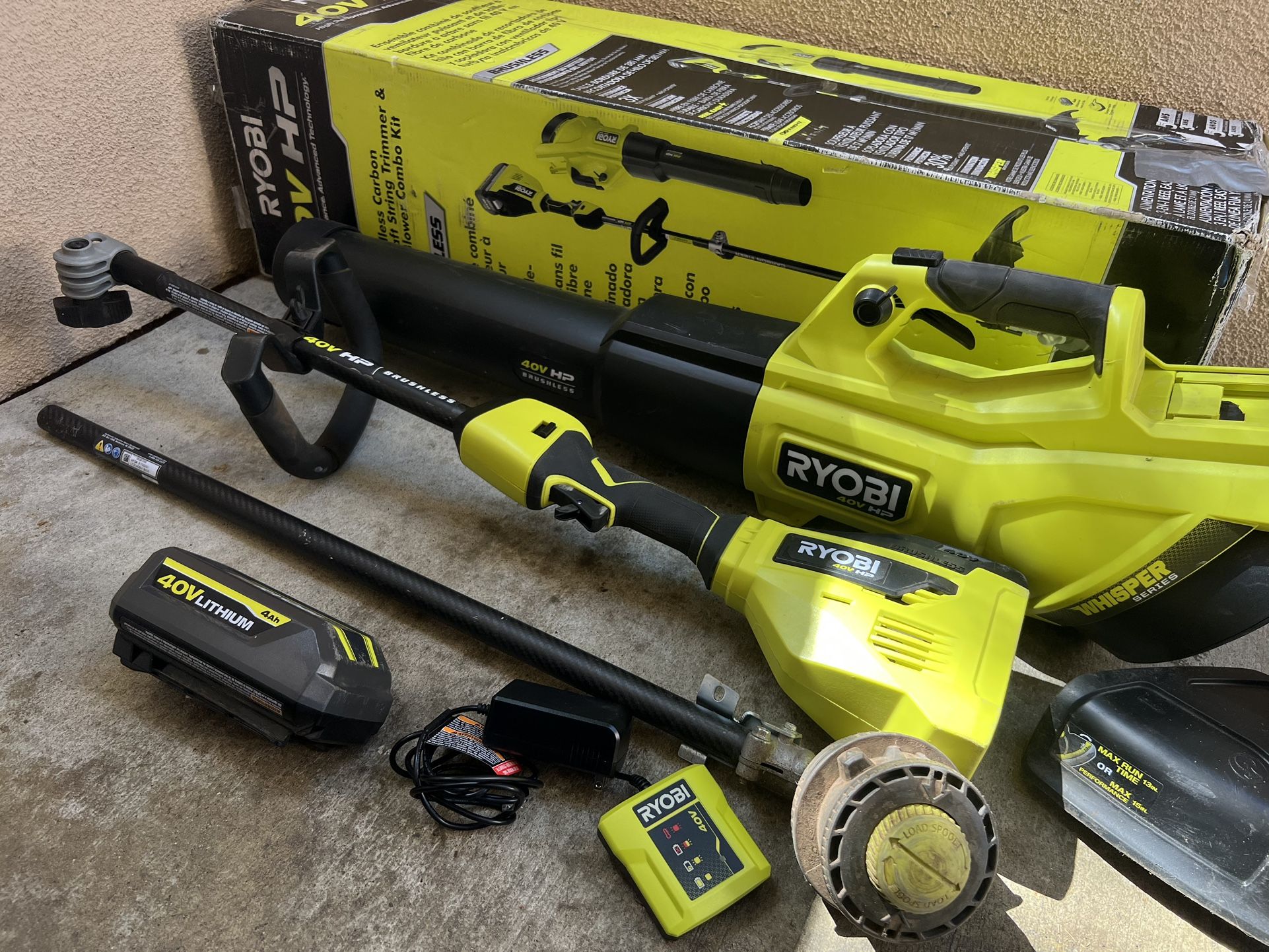 RYOBI 40V HP Brushless 600 CFM 155 MPH Cordless Leaf Blower and Carbon Fiber String Trimmer with 4.0 Ah Battery and Charger