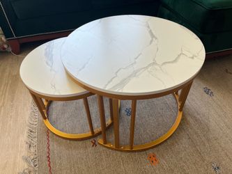 Nesting coffee table in marble finish.