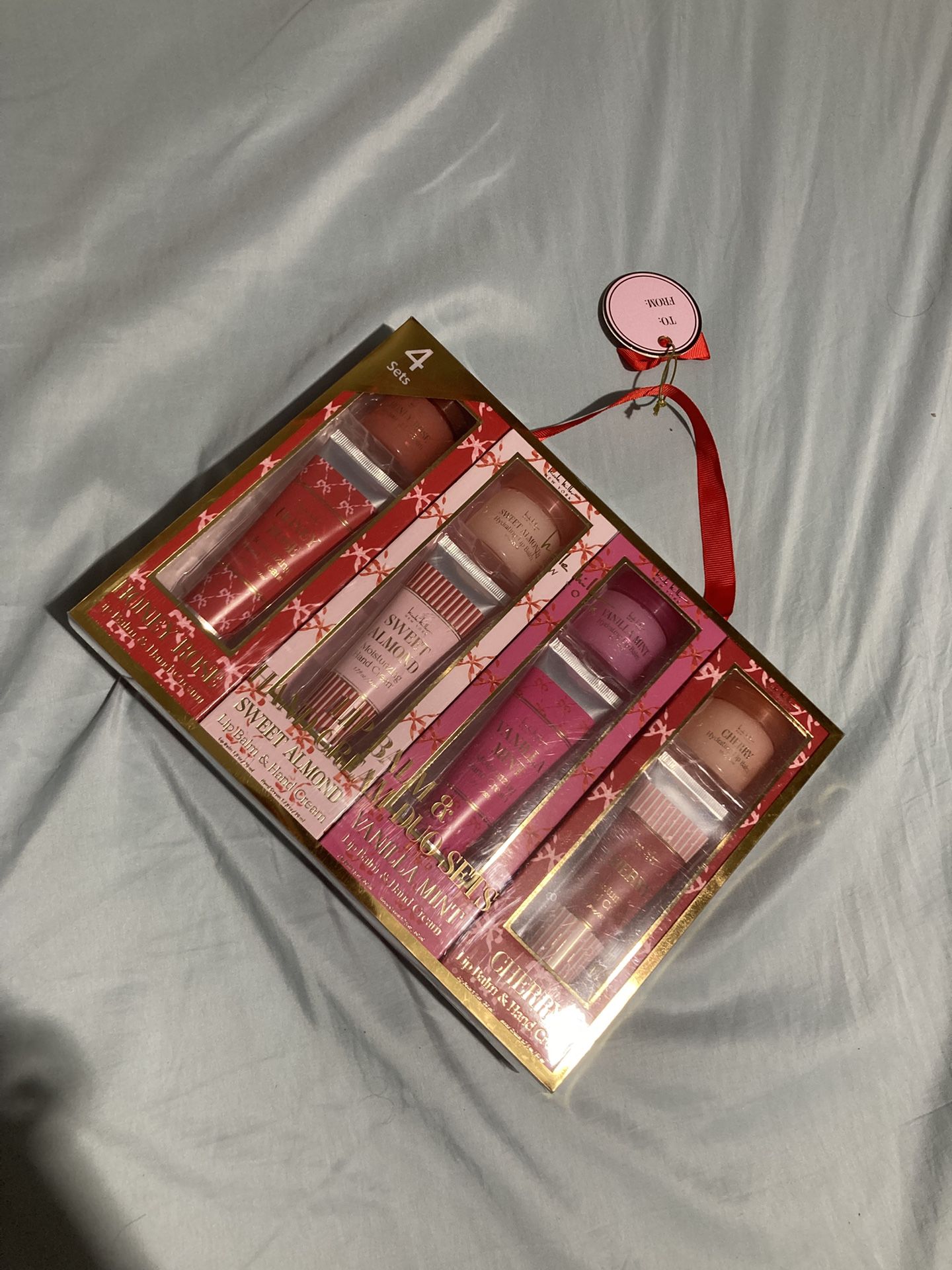 Nicole Miller 4-Piece Lip Balm & Hand Cream Gift Set – New