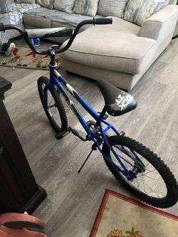 Blue huffy rock it 20-inch kids bike