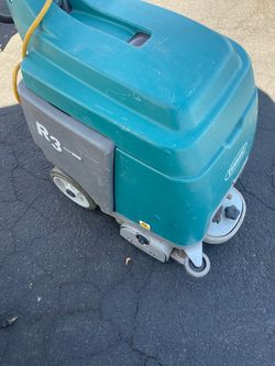 The Tennant R3 Ready Space Carpet Extractor Cleaner is a portable cleaning solution with an adjustable handle for easy maneuverability. It features a 